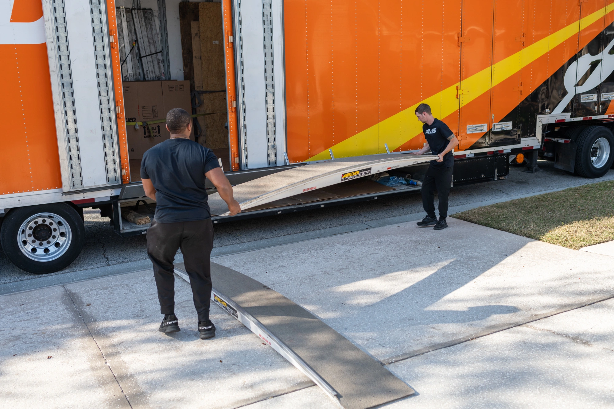 Allied movers setting up truck loading ramp