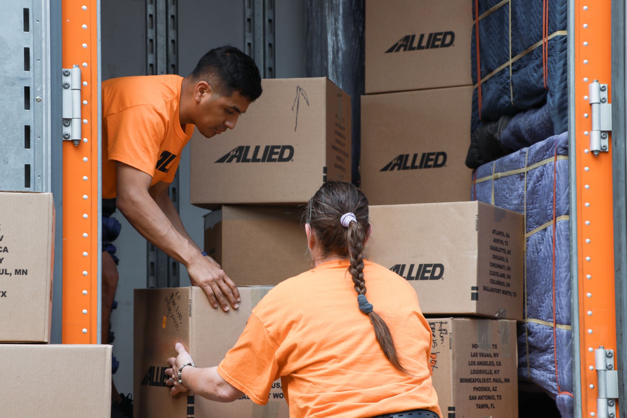Allied movers loading boxes into truck